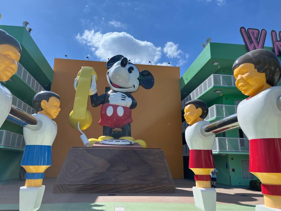 mickey and foosball statues on the grounds of pop century resort