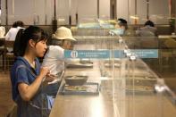 People eat lunch between plastic partitions following the outbreak of coronavirus disease (COVID-19), in Taipei,