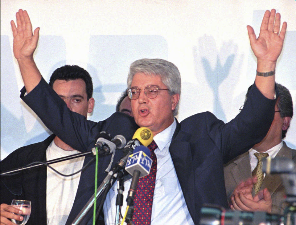 FILE - David Levy, former Israeli foreign minister and breakaway from the opposition Likud Party, holds his hands high over his head as he announces the founding of his own party and plans to run for the Premiership in the 1996 elections, June 18, 1995, in Tel Aviv, Israel. Levy, an Israeli politician born in Morocco who fought tirelessly against deep-seated racism against Jews from North Africa and went on to serve as foreign minister and hold other senior governmental posts, died Sunday, June 2, 2024. He was 86. (AP Photo/Nati Harnik, File)