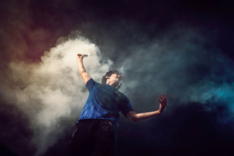 A protester holds a smoke flare during an anti-government demonstration. Mariana Nedelcu/SOPA Images via ZUMA Press Wire/dpa