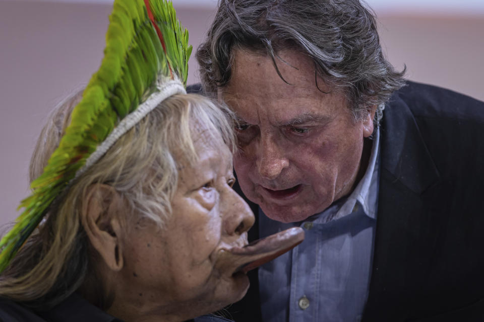 FILE - Indigenous Chief Raoni Metuktire, left, and Belgian filmmaker Jean-Pierre Dutilleux attend a meeting at the ChangeNOW summit in Paris, France, May 27, 2023. (AP Photo/Aurelien Morissard, File)