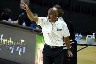 St. Peter's head coach Shaheen Holloway reacts during the first half of an NCAA college basketball game against Maryland, Friday, Dec. 4, 2020, in College Park, Md. (AP Photo/Julio Cortez)