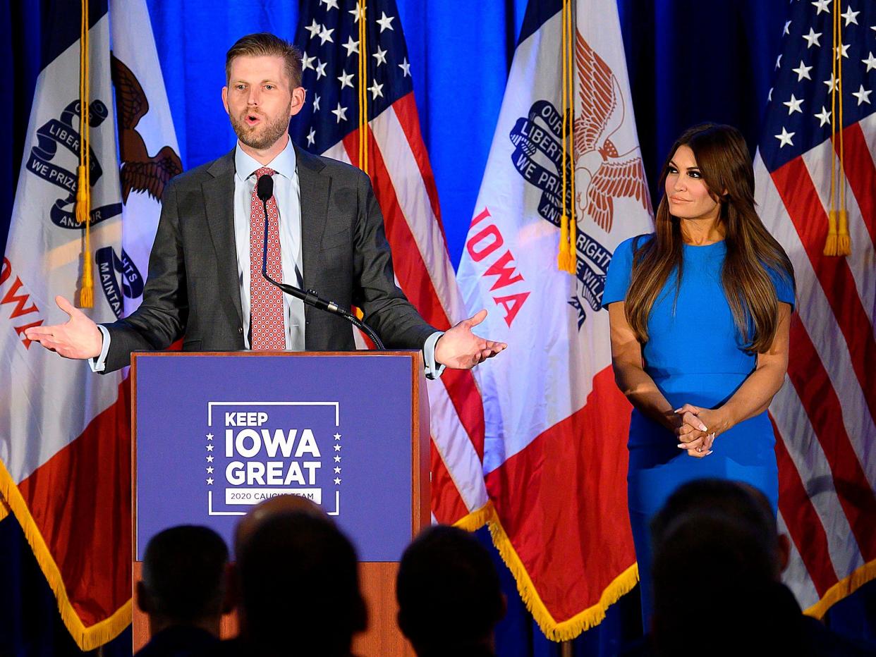 Eric Trump speaks with Donald Trump Jr's fiancé Kimberly Guilfoyle during a "Keep Iowa Great" press conference in Des Moines, IA, on February 3, 2020.