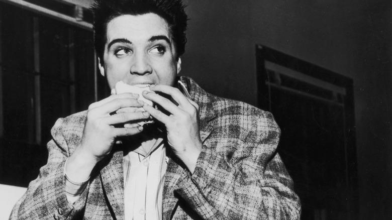 Elvis eating a burger