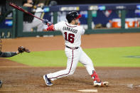 Atlanta Braves' Travis d'Arnaud (16) follows through on a home run during the fourth inning in Game 2 of a baseball National League Division Series against the Miami Marlins Wednesday, Oct. 7, 2020, in Houston. (AP Photo/Eric Gay)