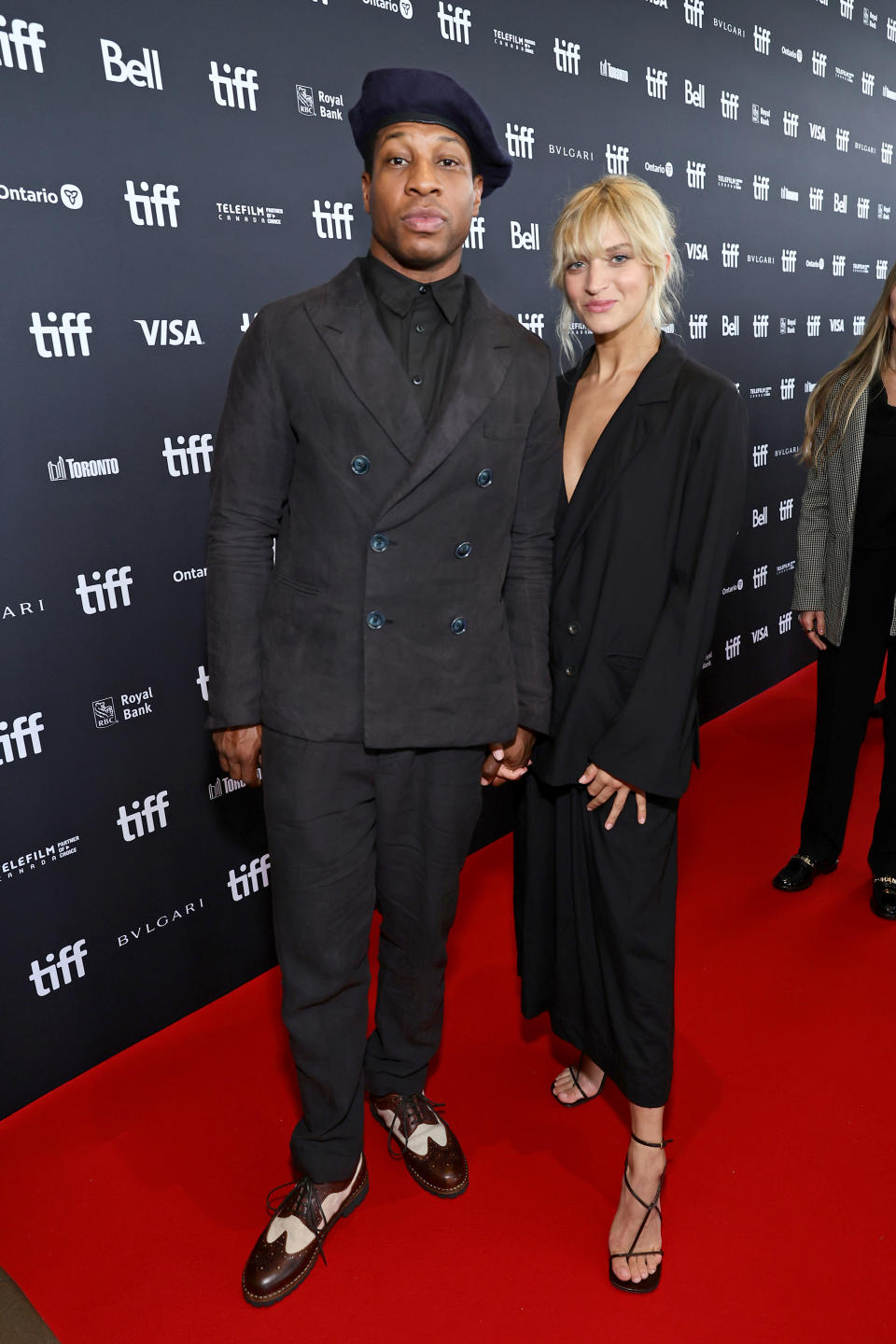 Jonathan Majors and guest attend the “Devotion” Premiere at Cinesphere on September 12, 2022 in Toronto, Ontario.