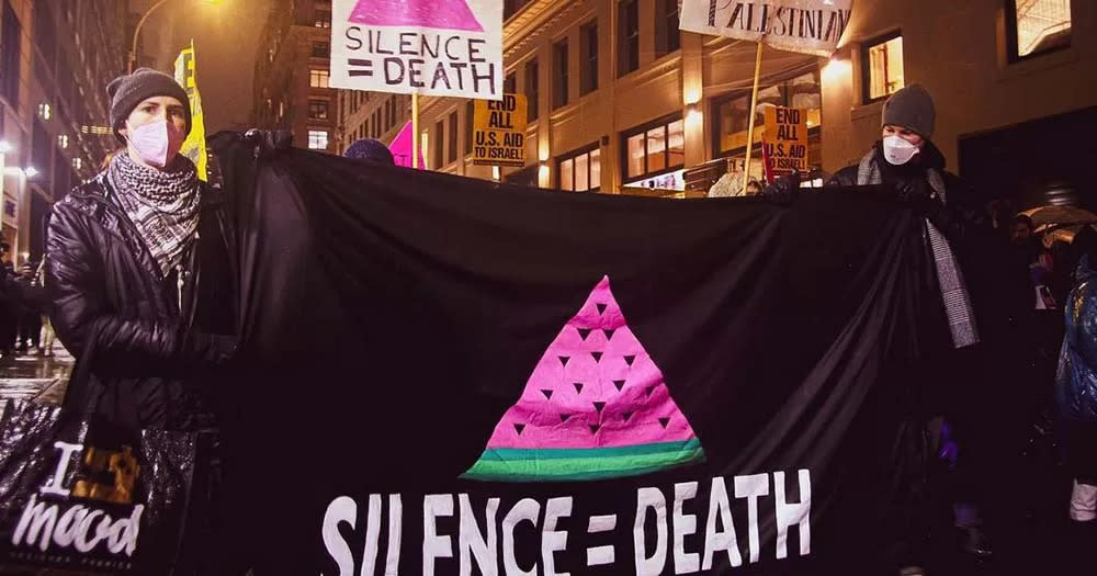 Act Up protestors hold water melon signs to demonstrate solidarity with Palestine