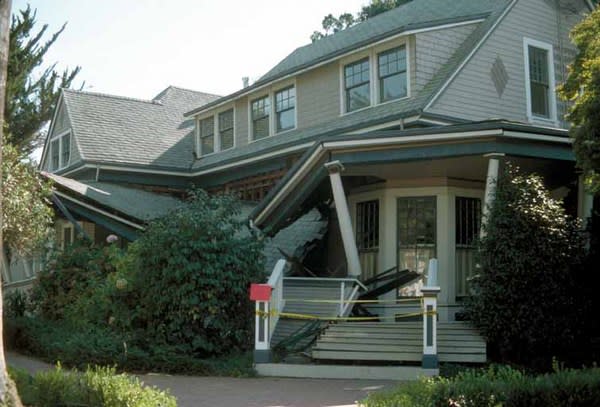 A house remains intact, though its porch collapsed, following the 1989 Loma Prieta earthquake in Northern California. Experts say it's safer to stay in place during an earthquake.