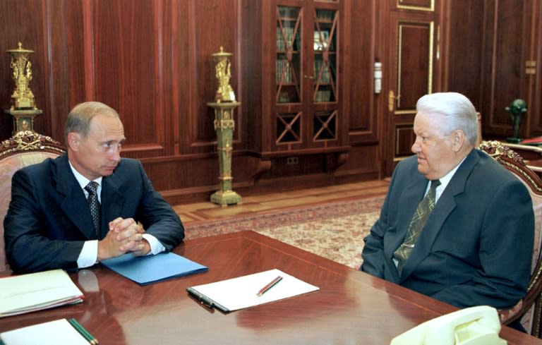 Then-Security Council Secretary Vladimir Putin (L) listens to then-Russian President Boris Yeltsin during their meeting in Moscow's Kremlin, on July 27, 1999