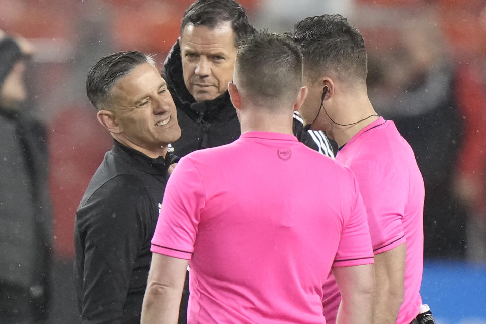 Toronto FC coach John Herdman, left, has words with the with officials after the team's MLS soccer match against New York City FC on Saturday, May 11, 2024, in Toronto. (Frank Gunn/The Canadian Press via AP)