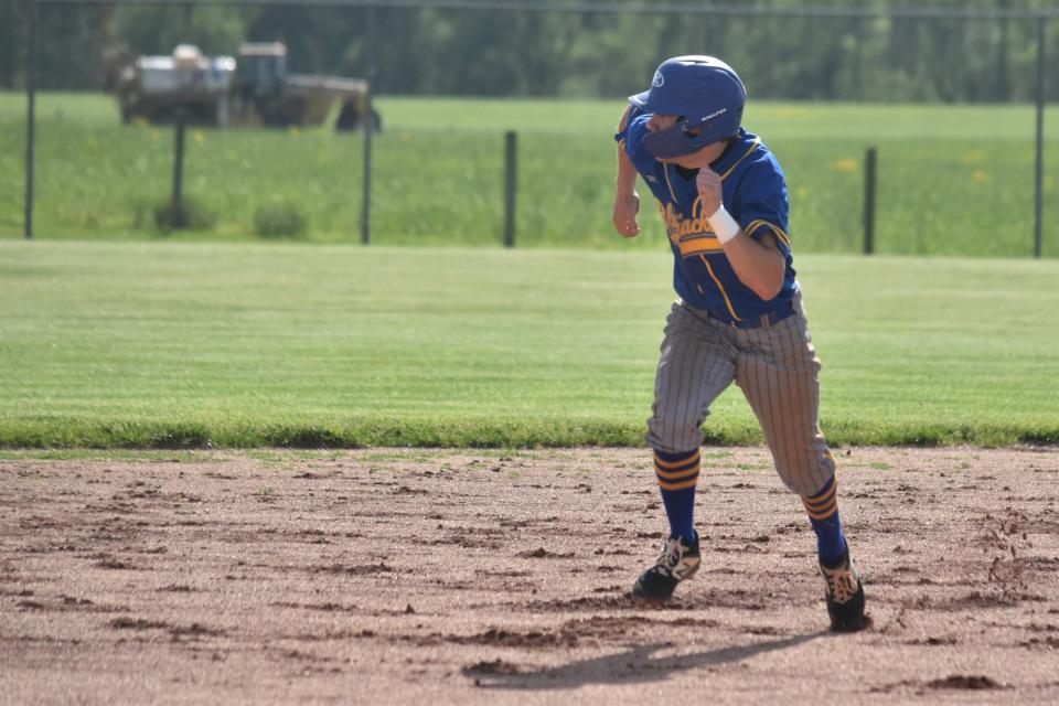 Dayson Martin bolts toward third base during Mitchell's trip to West Washington.