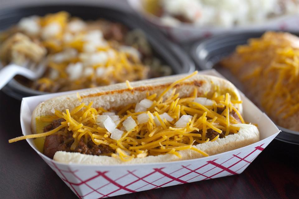 Regular coney along with coney spaghetti and smothered chicken and cheese wrap at Dad's Coneys and Wraps in the Graceland Shopping Center.