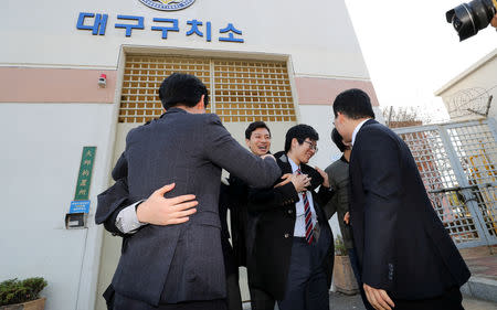 South Korean conscientious objectors celebrate after being released from Daegu detention center in Daegu, South Korea, November 30, 2018. Yonhap via REUTERS