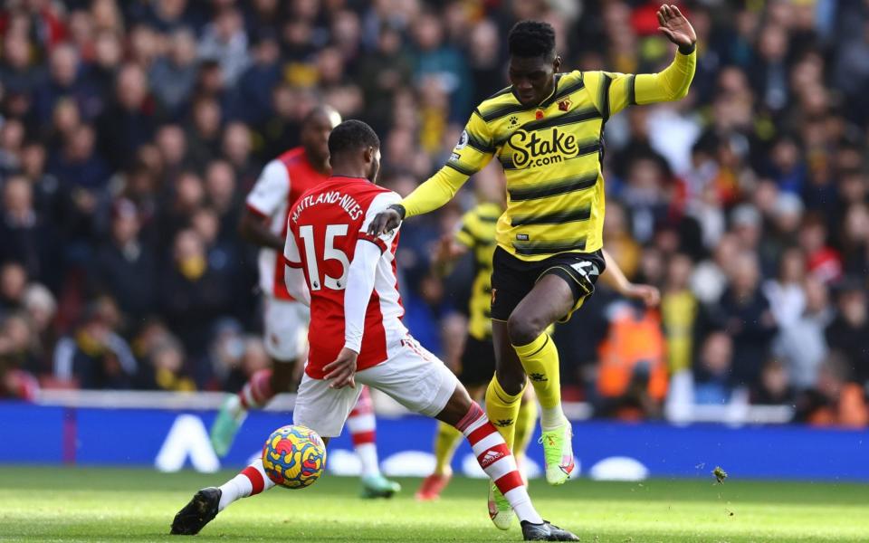 Watford's Ismaila Sarr in action with Arsenal's Ainsley Maitland-Niles - Reuters