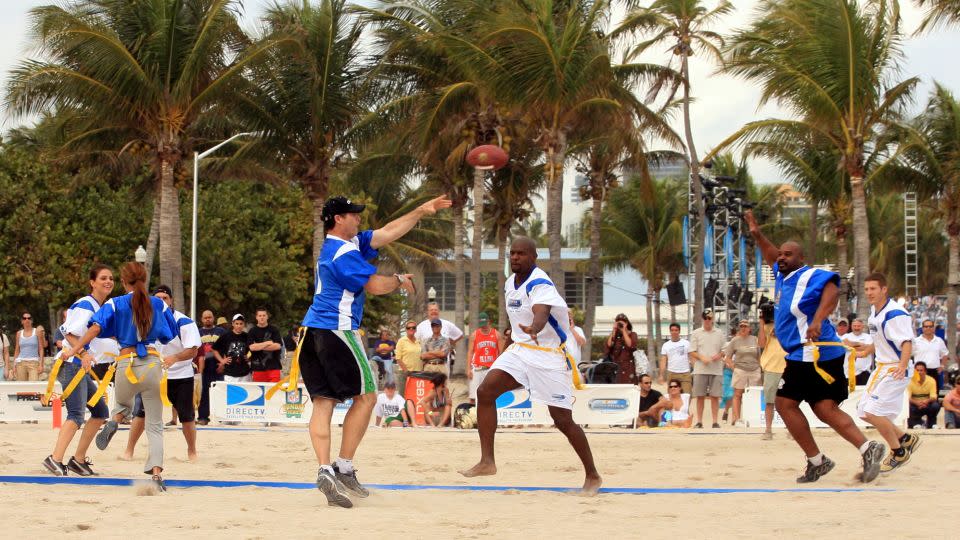Young throws a pass during a celebrity Beach Bowl flag football game in 2007. - Luis M. Alvarez/AP