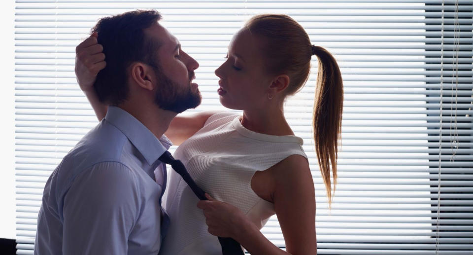 The chemistry between Rob Harris* and his colleague was instant. Posed by models. (Getty Images)