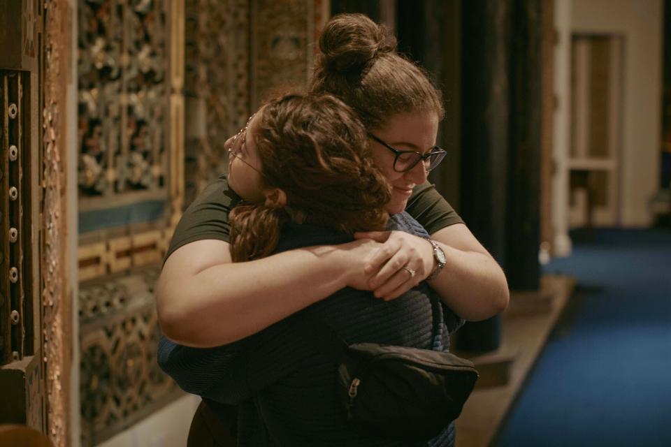 Jews hug after a communal prayer to honor and offer support for the victims in Israel at B'nai Jeshurun Synagogue on Thursday, Oct. 12, 2023, in New York. (AP Photo/Andres Kudacki)