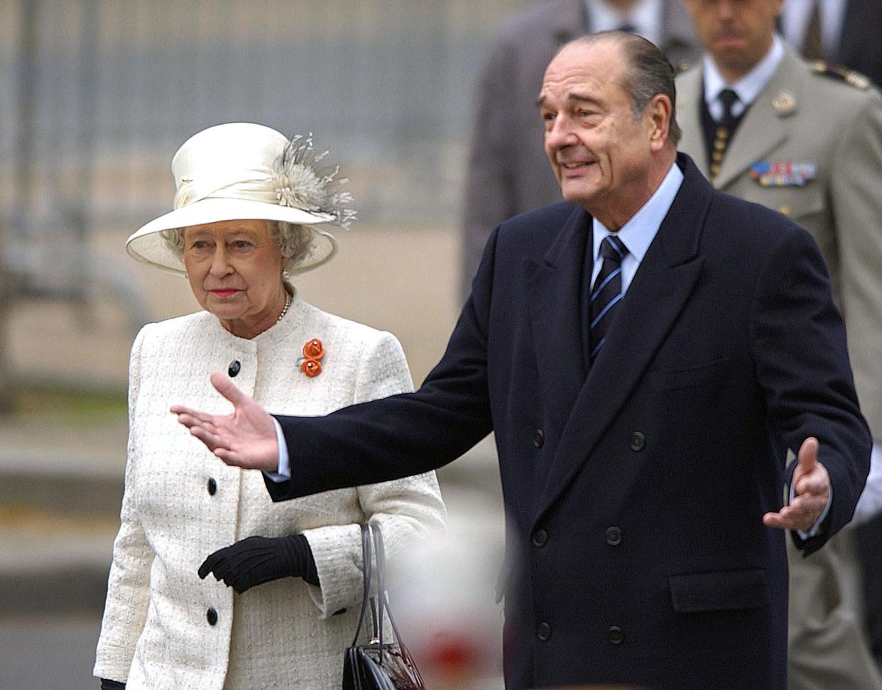 Britain's Queen Elizabeth II is greeted by French President Jacques Chirac on the Champs Elysees in Paris Monday, April 5, 2004 (AP)