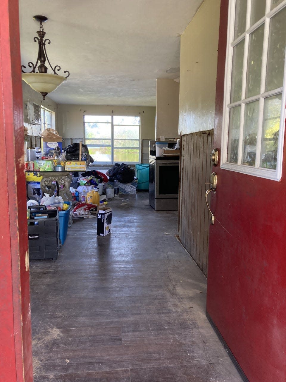 Warren Adkins has ripped out the drywall in his home up to four feet high after Hurricane Ian washed the waters of the Gordon River into his home.