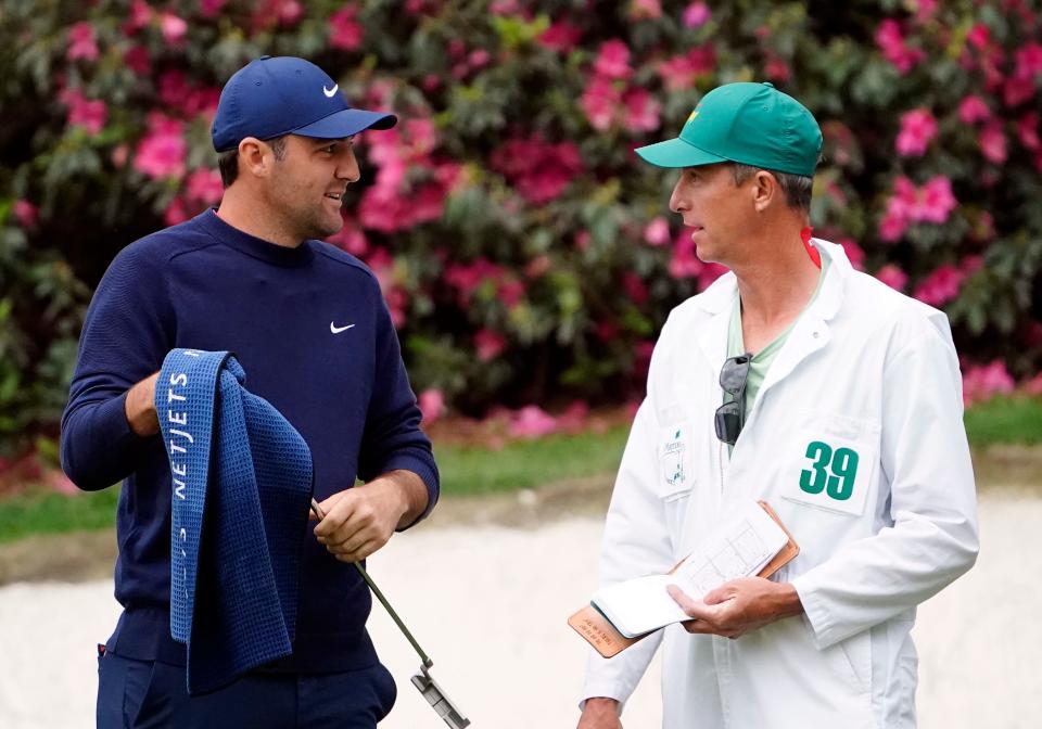 Scottie Scheffler and caddie Ted Scott, who has now been on the bag for three Masters titles.