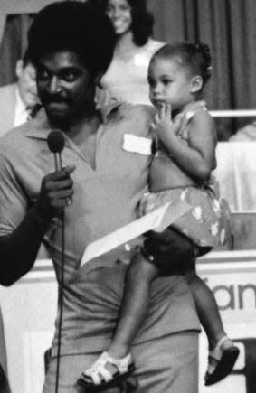 Gayle Brown-Mayes, mother of Hudson Mayes, as a young girl in the arms of her father Roger Brown.