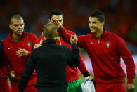 KHARKOV, UKRAINE - JUNE 17: Cristiano Ronaldo (R) of Portugal greets Wesley Sneijder of Netherlands during the UEFA EURO 2012 group B match between Portugal and Netherlands at Metalist Stadium on June 17, 2012 in Kharkov, Ukraine. (Photo by Lars Baron/Getty Images)