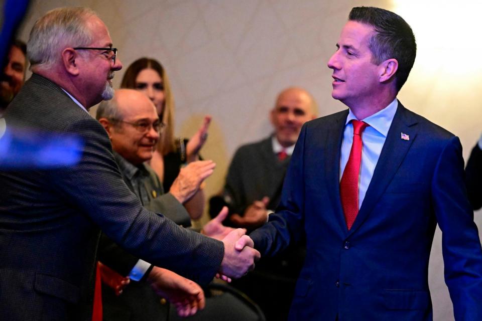 PHOTO: Cleveland businessman Bernie Moreno, a Republican candidate for U.S. Senate shakes hands with a supporter during his primary election night watch party in Westlake, Ohio, March 19, 2024.  (David Dermer/AP)