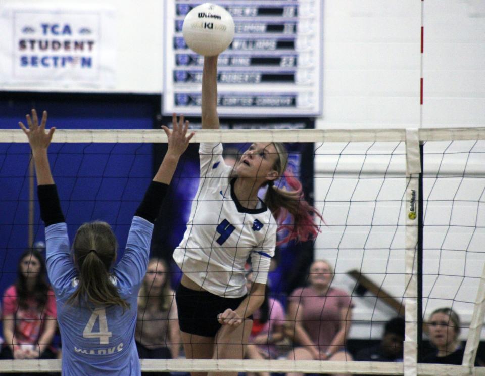 Trinity Christian's Avery Haney (4) spikes the ball during an Oct. 2 match against Ponte Vedra.