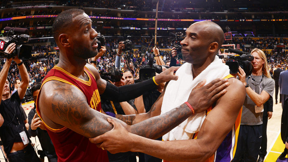 LeBron James hugs Kobe Bryant after a match.