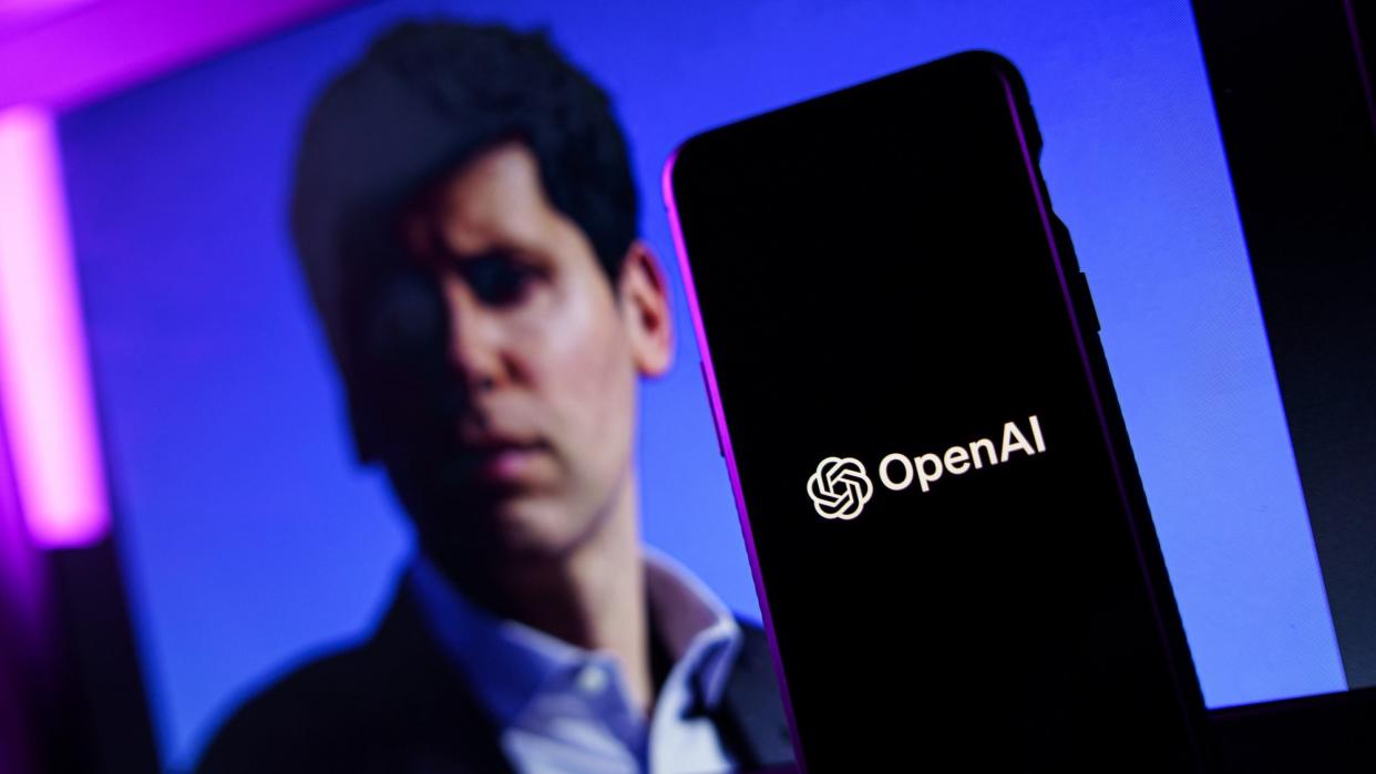 OpenAI logo and Sam Altman in background on screen.