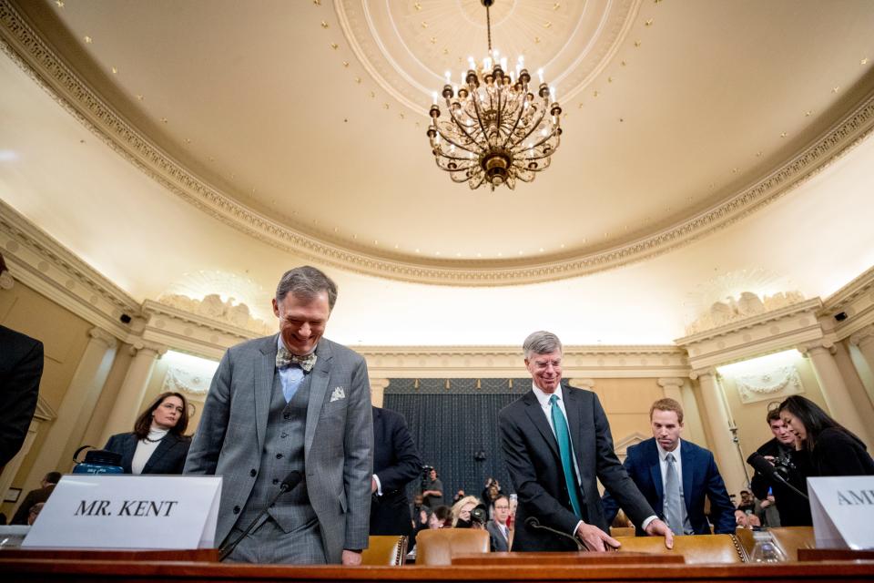 Career Foreign Service officer George Kent, left, and top U.S. diplomat in Ukraine William Taylor, right, return from a short break in testimony before the House Intelligence Committee on Capitol Hill in Washington, Wednesday, Nov. 13, 2019, during the first public impeachment hearing of President Donald Trump.