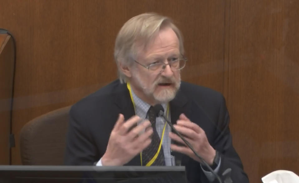 In this image from video, Dr. Martin Tobin testifies as Hennepin County Judge Peter Cahill presides before the court Thursday, April 15, 2021, in the trial of former Minneapolis police Officer Derek Chauvin at the Hennepin County Courthouse in Minneapolis, Minn. Chauvin is charged in the May 25, 2020 death of George Floyd. (Court TV via AP, Pool)