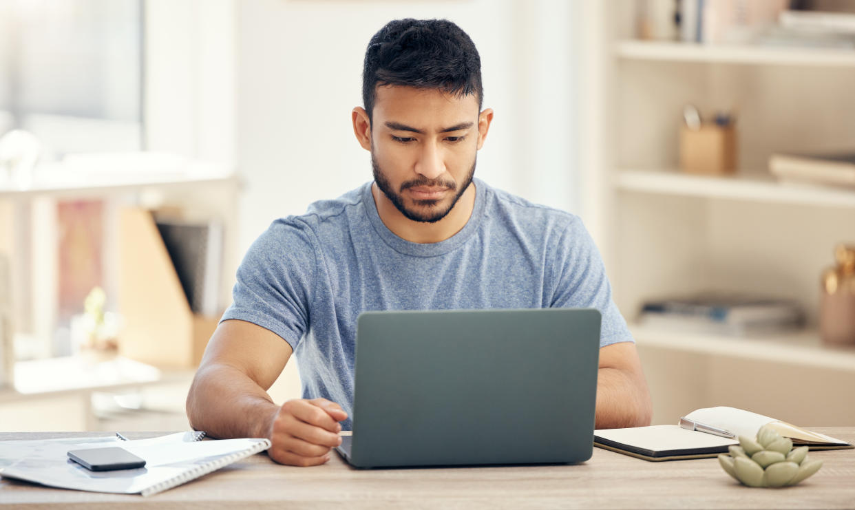 Handsome man working on laptop