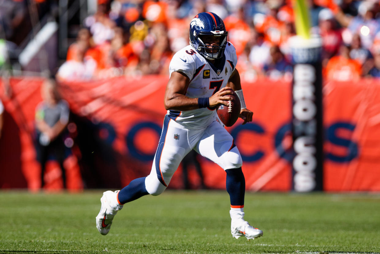 DENVER, CO - SEPTEMBER 17:  Quarterback Russell Wilson #3 of the Denver Broncos runs with the football and looks to pass during the second quarter against the Washington Commanders at Empower Field at Mile High on September 17, 2023 in Denver, Colorado. (Photo by Justin Edmonds/Getty Images)