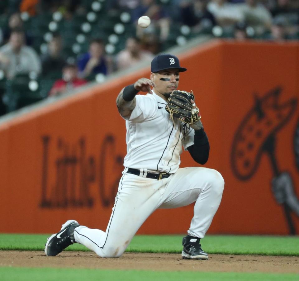 Detroit Tigers shortstop Javier Baez (28) throws out San Francisco Giants first baseman J.D. Davis (7) during 10th-inning action at Comerica Park in Detroit on Friday, April 14, 2023.