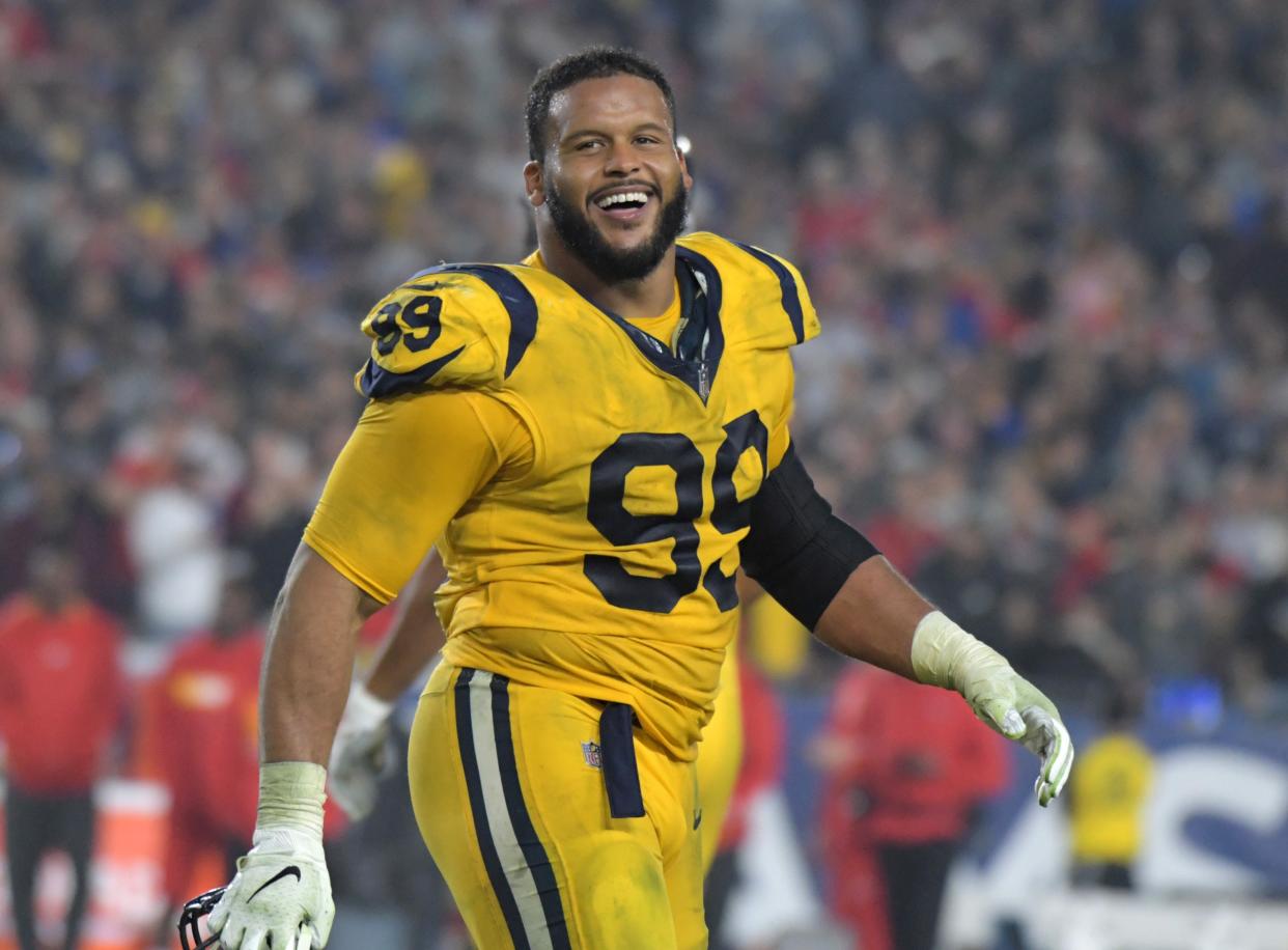 Nov 19, 2018; Los Angeles, CA, USA; Los Angeles Rams defensive end Aaron Donald (99) celebrates in the fourth quarter against the Kansas City Chiefs at the Los Angeles Memorial Coliseum. The Rams defeated the Chiefs 54-51 in the highest scoring Monday Night Football game ever. Mandatory Credit: Kirby Lee-USA TODAY Sports