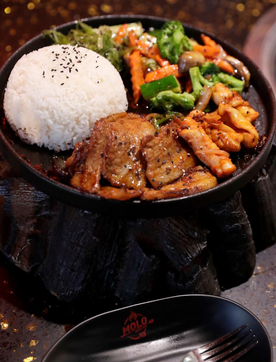 Combo platter with pork belly and spicy calimari at Molo Asian BBQ on Tuesday, May 14, 2024 in Grand Chute, Wis. 
Wm. Glasheen USA TODAY NETWORK-Wisconsin
