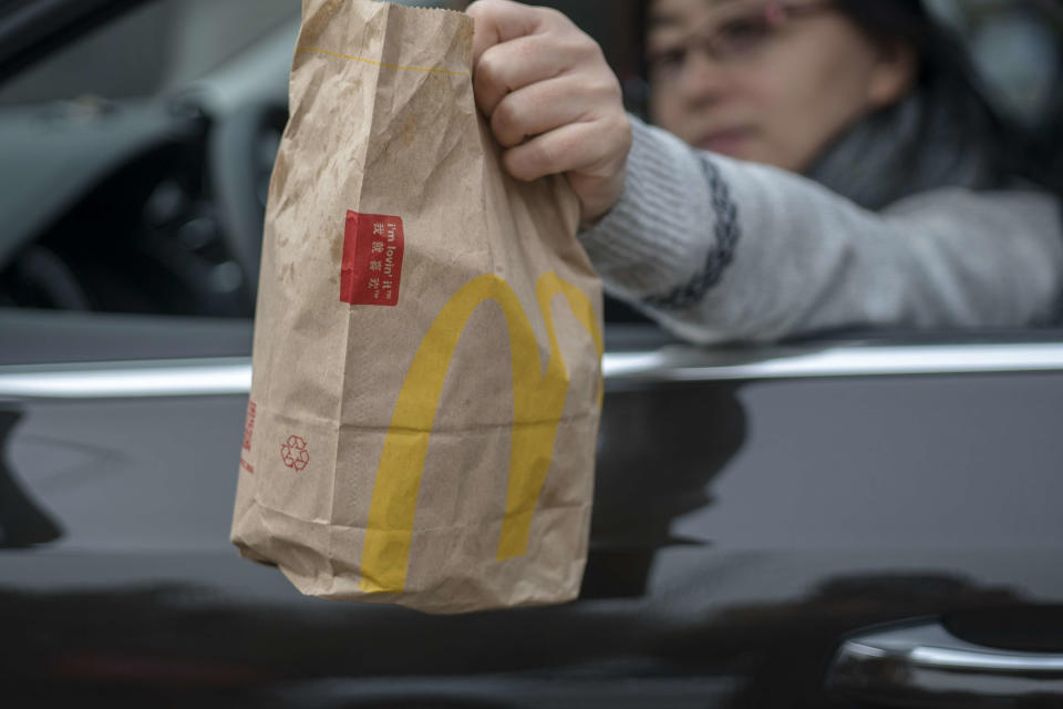 TIANJIN, CHINA - 2018/03/20: A customer bought food from a McDonald's Drive-Thru restaurant. McDonald's has added a 'Food Safety Quality Commission' in China at the end of 2017, and announced that it would open about 2000 new McDonald's restaurants in mainland China in the next five years. (Photo by Zhang Peng/LightRocket via Getty Images)
