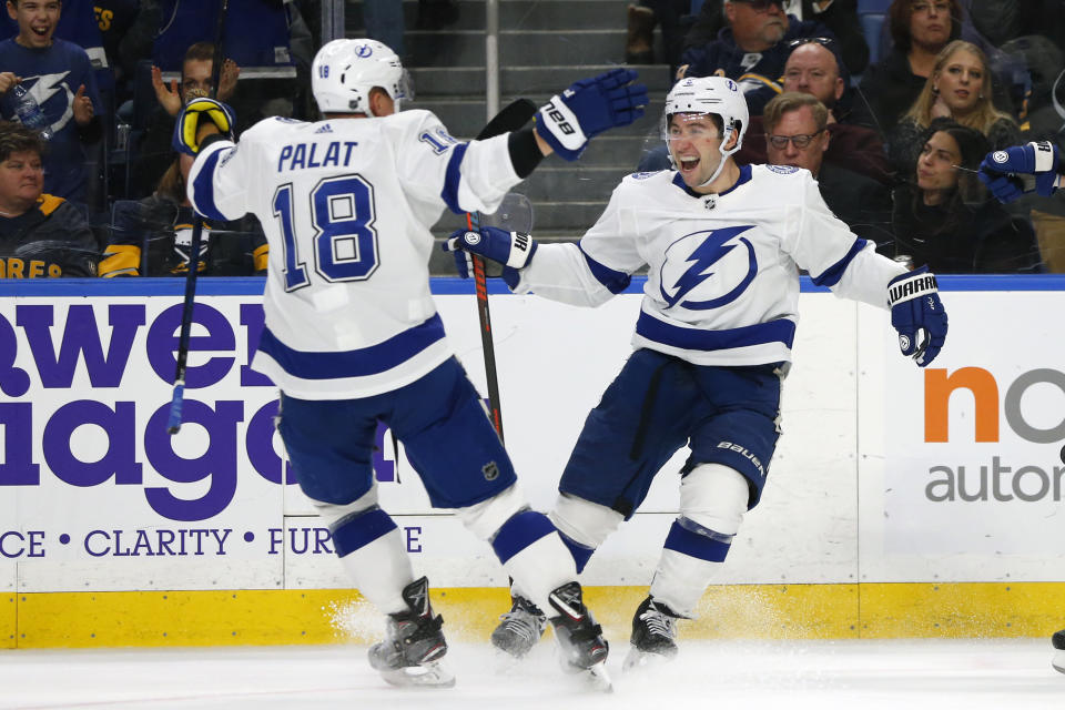 Tampa Bay Lightning forward Tyler Johnson (9) celebrates his goal with teammate Ondrej Palat (18during the second period of an NHL hockey game against the Buffalo Sabres, Tuesday, Dec. 31, 2019, in Buffalo, N.Y. (AP Photo/Jeffrey T. Barnes)