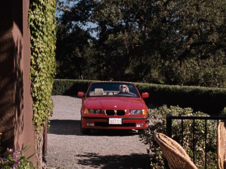 Meredith driving in a red car in "The Parent Trap."