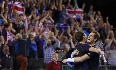 Tennis - Great Britain v Australia - Davis Cup Semi Final - Emirates Arena, Glasgow, Scotland - 19/9/15 Men's Doubles - Great Britain's Andy Murray celebrates with Jamie Murray after winning their match Action Images via Reuters / Jason Cairnduff Livepic