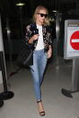 <p>Skinny jeans, strappy heels, a floral bomber and the latest It bag? RHW <i>really </i>knows how to do airport style. <i>(Photo by Splash News)</i></p>