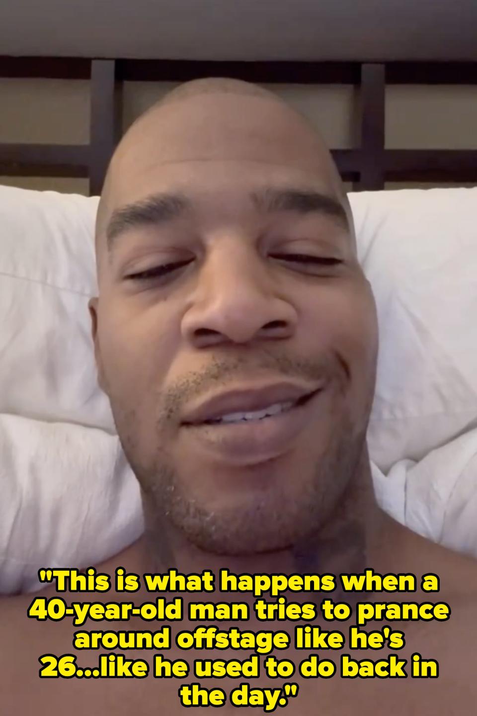 Closeup of Kid Cudi in bed