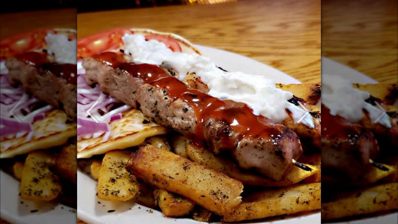 Kebab and fries with sauce