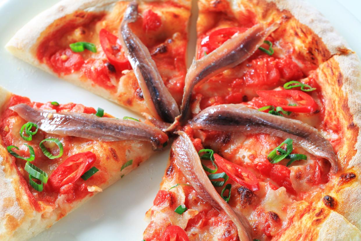 Pizza with anchovies and red pepper