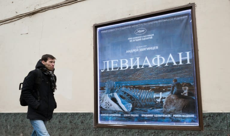 A man walks past a billboard for "Leviathan" in central Moscow on Febrary 5, 2015