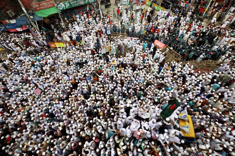 Muslims take part in a protest in Dhaka