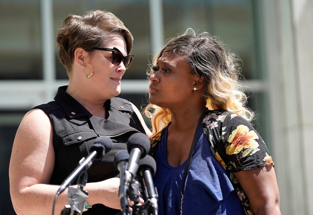 George Floyd’s partner Courteney Ross, left, talks to the media outside the Federal Courthouse with Toshira Garraway Allen, an organizer for Families Supporting Families Against Police Violence Wednesday, July 27, 2022 in St. Paul, Minn. (David Joles/Star Tribune via AP)