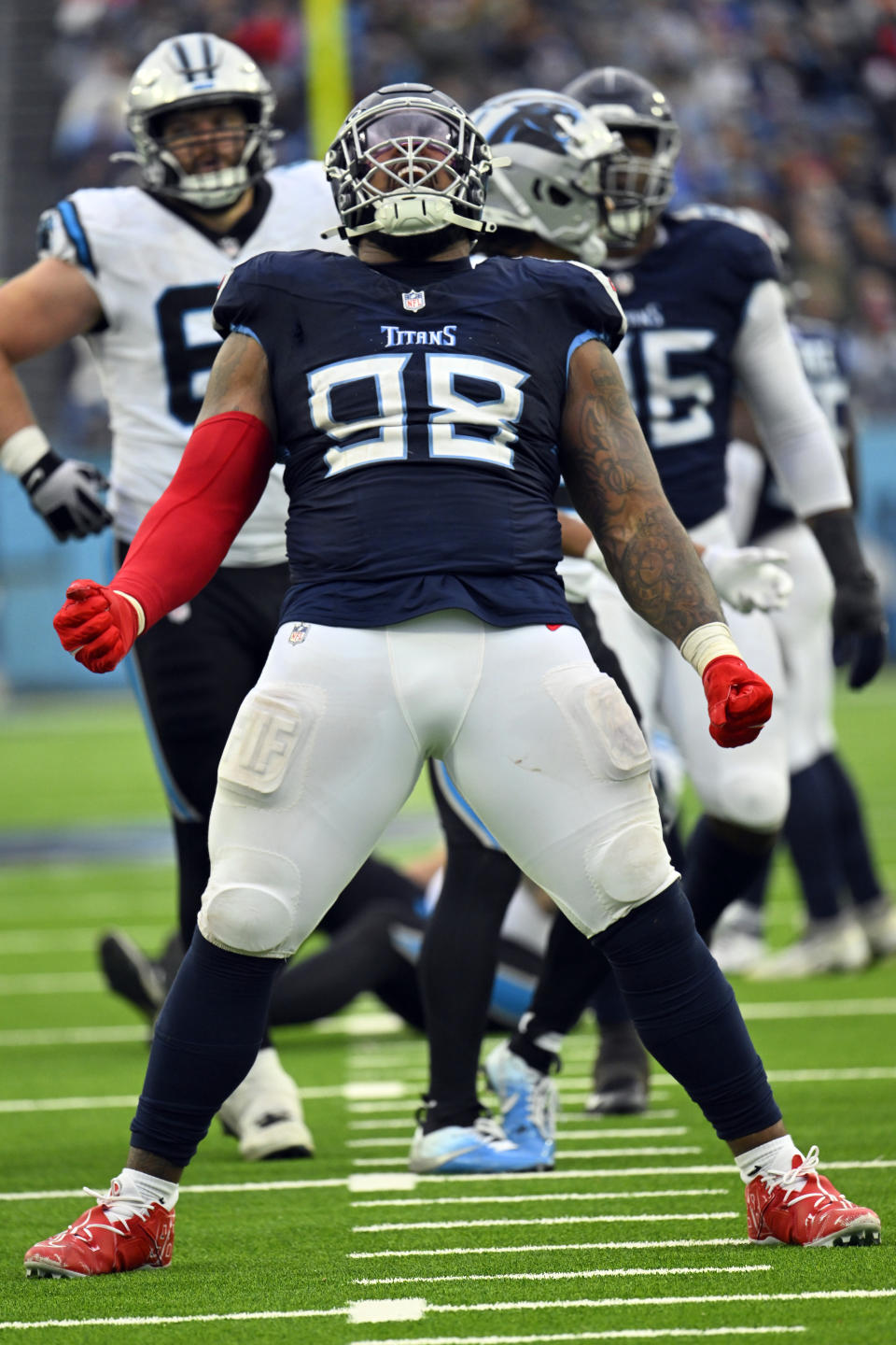 Tennessee Titans defensive tackle Jeffery Simmons (98) celebrates after a sack against the Carolina Panthers during the second half of an NFL football game Sunday, Nov. 26, 2023, in Nashville, Tenn. (AP Photo/John Amis)