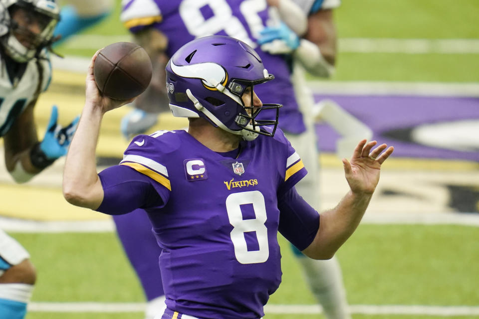 Minnesota Vikings quarterback Kirk Cousins throws a pass during the first half of an NFL football game against the Carolina Panthers, Sunday, Nov. 29, 2020, in Minneapolis. (AP Photo/Jim Mone)